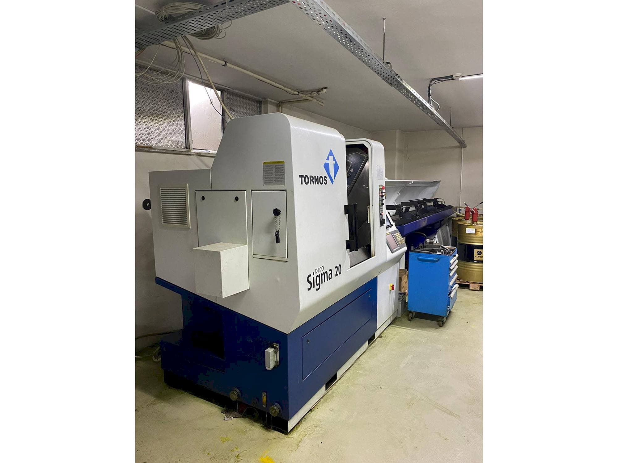 Linkerzijdeaanzicht  van Tornos Delta Sigma 20  machine