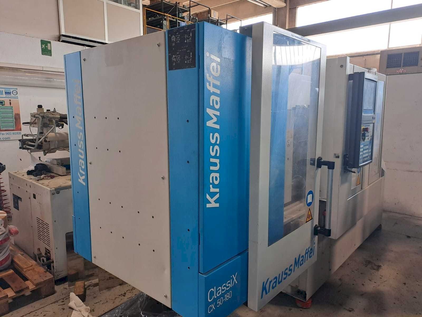 Links zicht  van Krauss Maffei 50-180CX  machine
