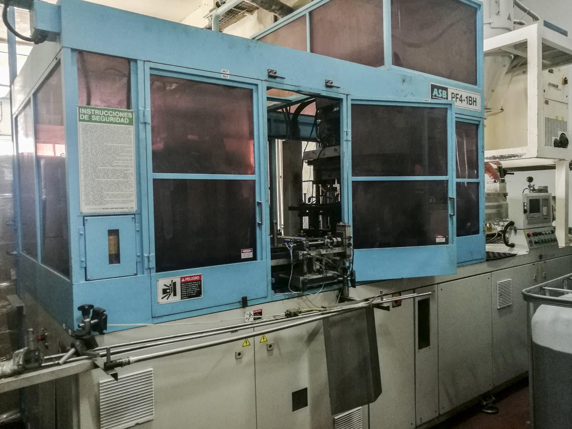 Links zicht van NISSEI ASB PF4-1BH machine
