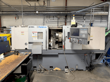 Vooraanzicht  van Okuma Genos L300E-M with FMB Turbo 8-80  machine
