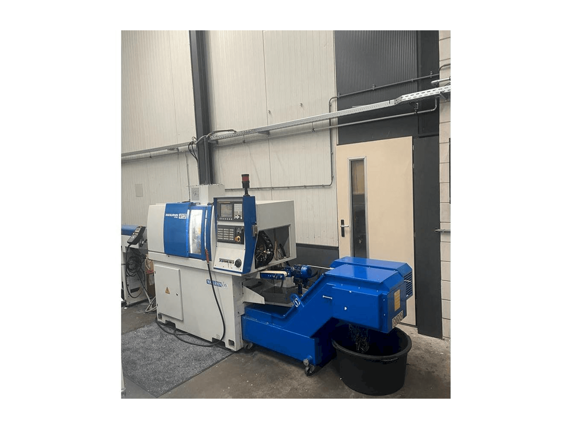 Vooraanzicht van Manurhin K'MX 413 machine