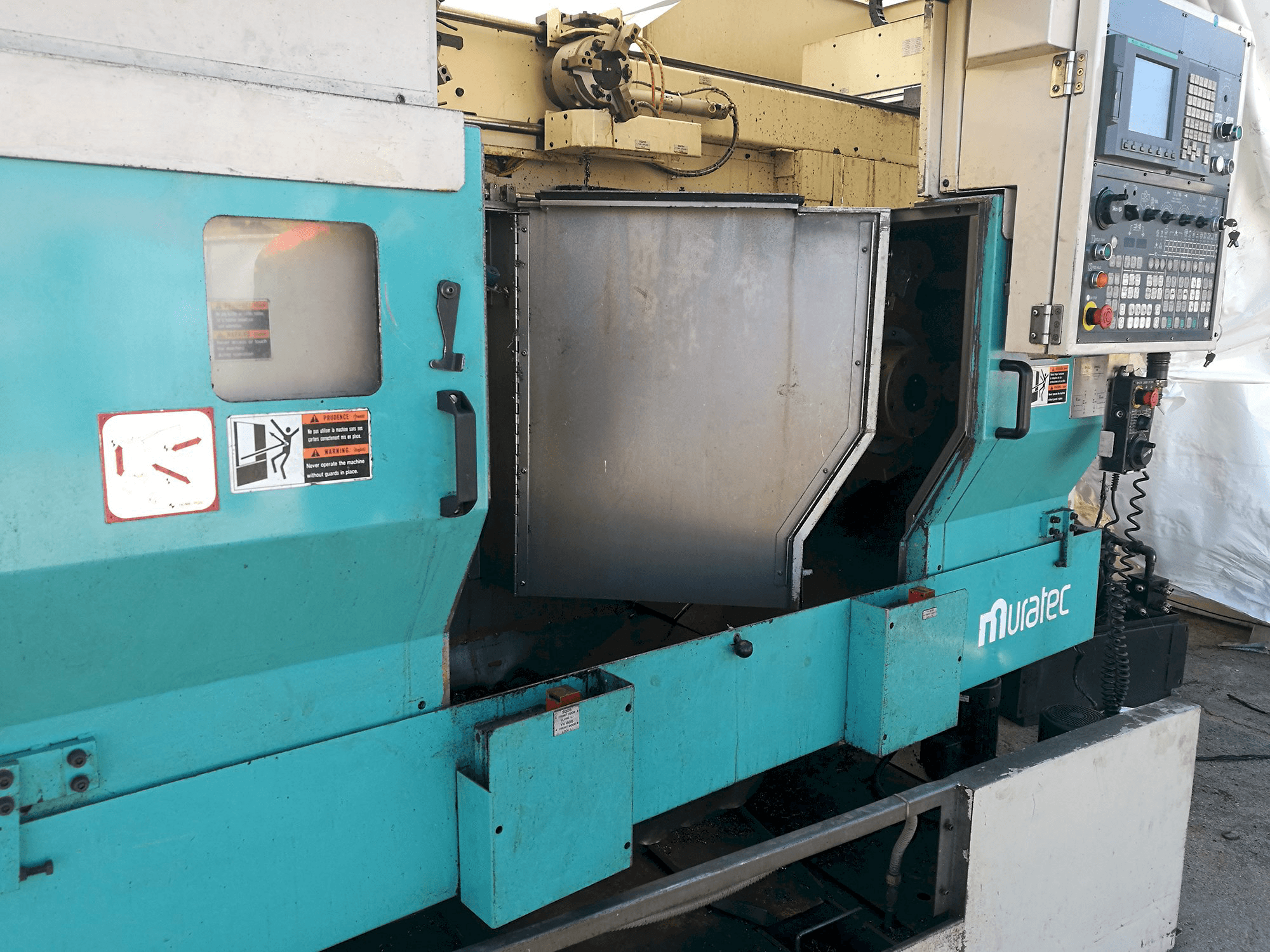 Links zicht van MURATA Muratec MW 200 machine
