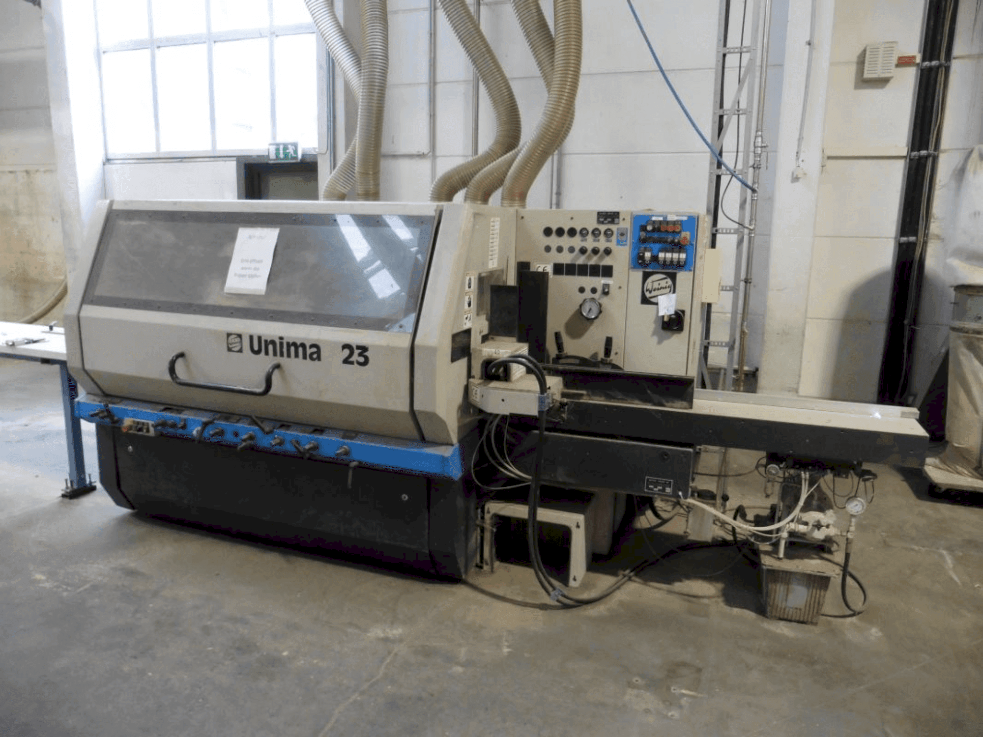 Vooraanzicht van WEINIG / DIMTER Unimat 23 E machine