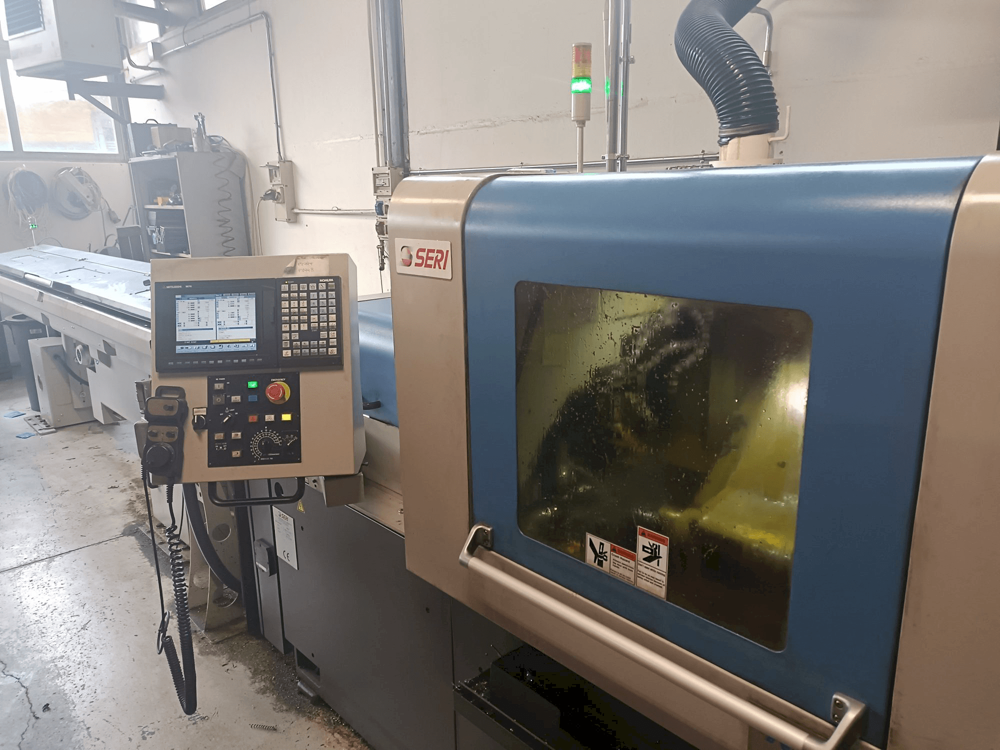 Vooraanzicht van NOMURA machine