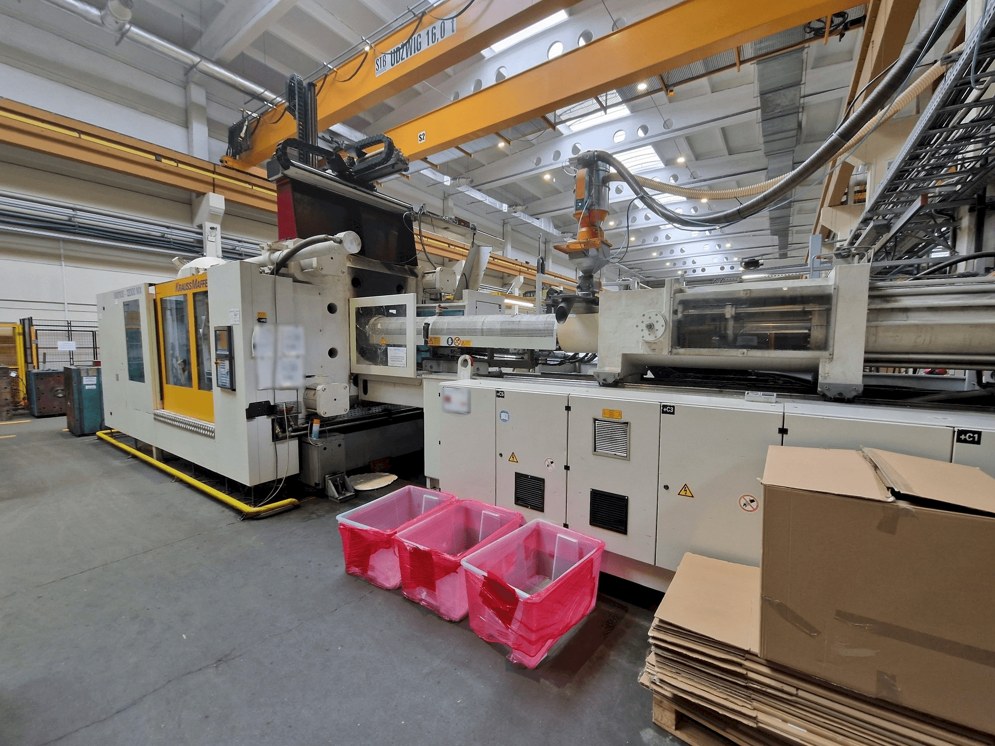 Vooraanzicht van Krauss Maffei 1100-12000 MX machine