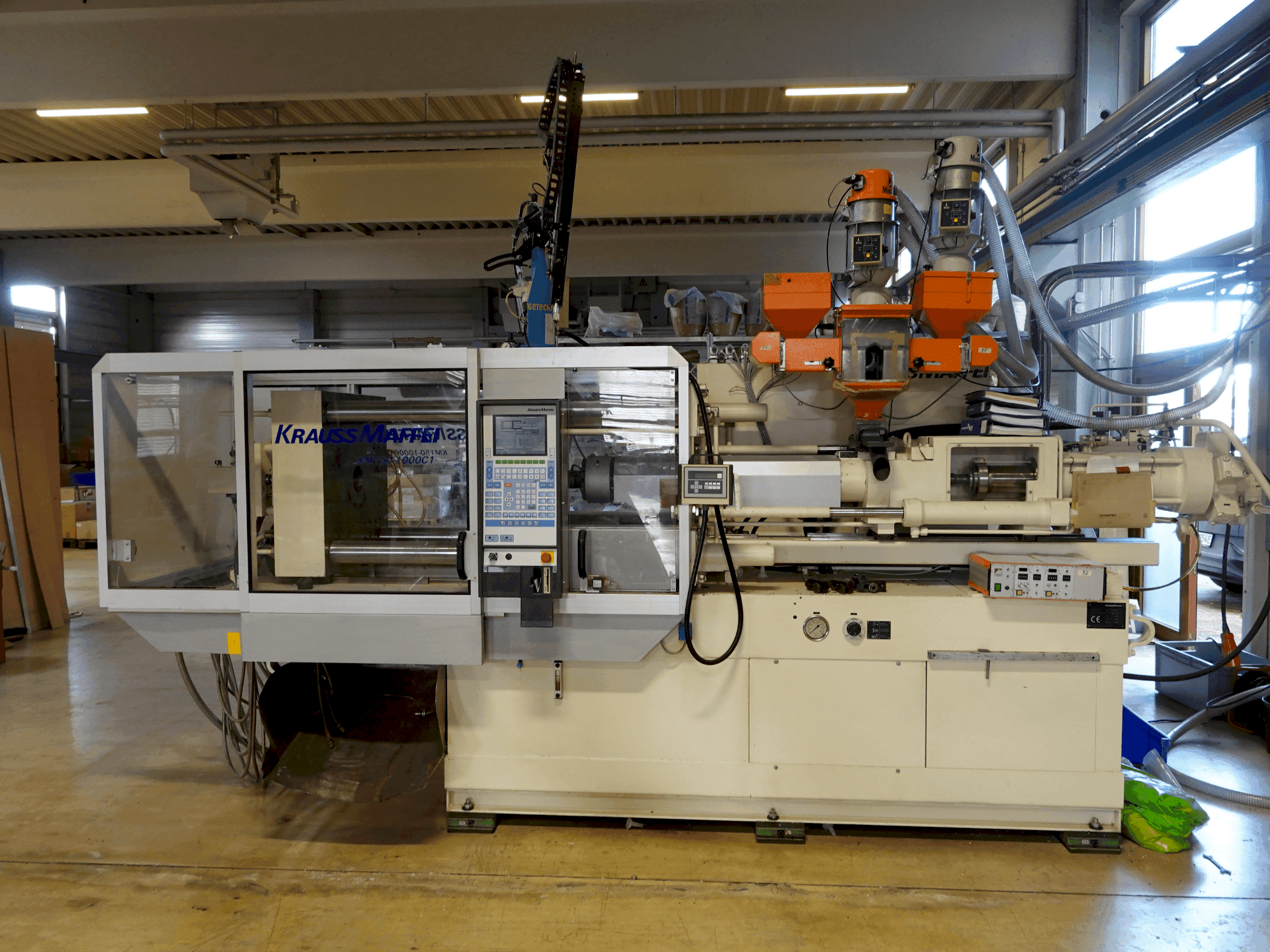 Vooraanzicht van Krauss Maffei KM 150-1000 C1 machine