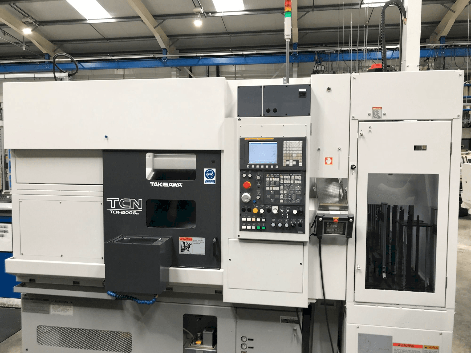 Vooraanzicht van Takisawa TCN-2100G L6 machine